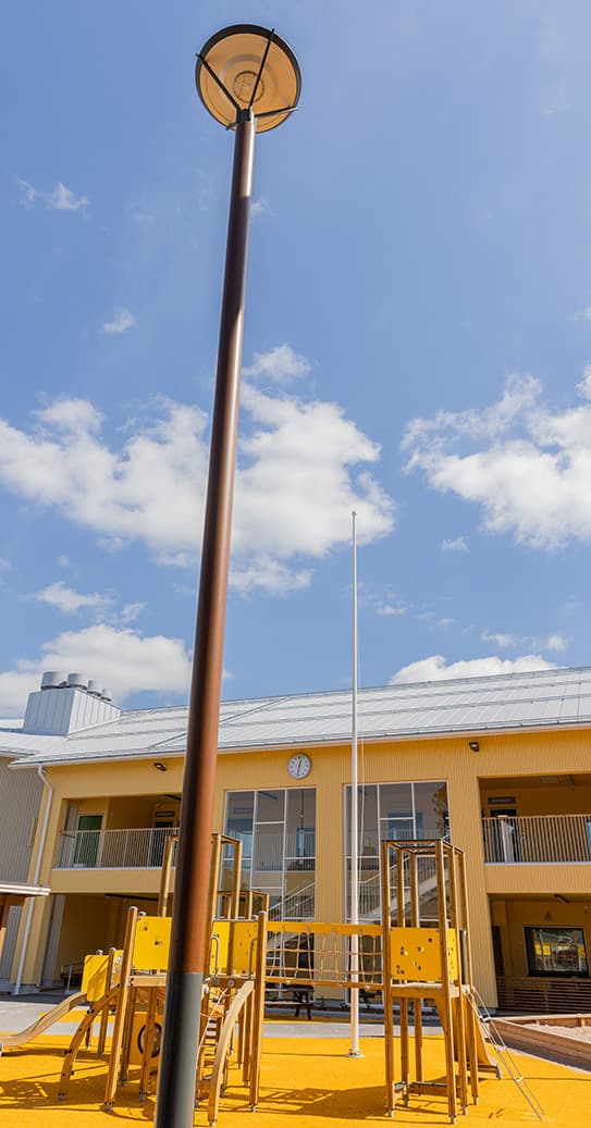 An ELEMENT light pole in a daycare courtyard